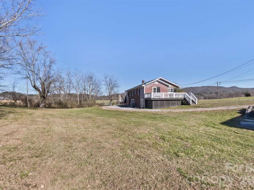 522 Calvert Road, Brevard, NC 28712.  MLS# CAR4381779, YatesRealty ID 2918. View from the barn looking toward the creek. A beautiful yard!