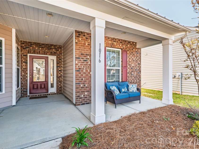 1016 Wells Lane, Fort Mill, SC 29707.  MLS# CAR4359886, YatesRealty ID 29188. Inviting, covered front porch
