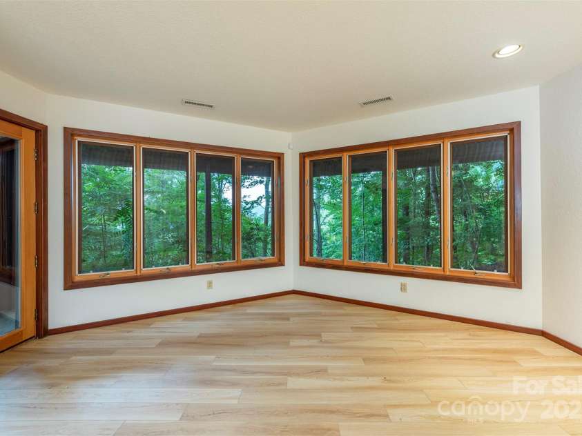 7 Winding Poplar Road, Black Mountain, NC 28711.  MLS# CAR4285345, YatesRealty ID 29194. Abundant windows downstairs as well.