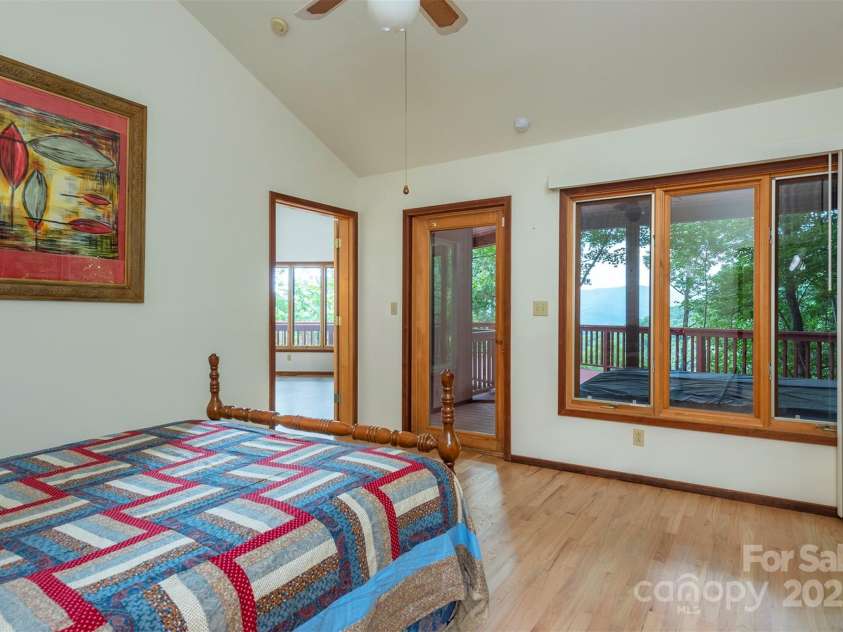 7 Winding Poplar Road, Black Mountain, NC 28711.  MLS# CAR4285345, YatesRealty ID 29194. Primary Bedroom with vaulted ceilings and skylights