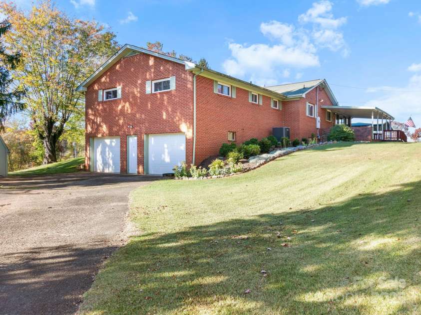 11 Aloha Circle, Candler, NC 28715.  MLS# CAR4313548, YatesRealty ID 292. Side Porch 