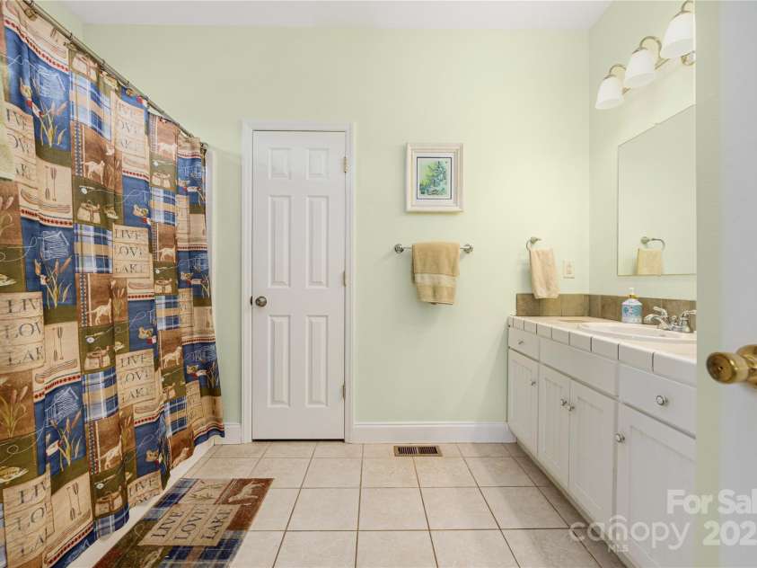 4478 Lake Drive, Sherrills Ford, NC 28673.  MLS# CAR4276198, YatesRealty ID 2920. Master bathroom w shower and two closets
