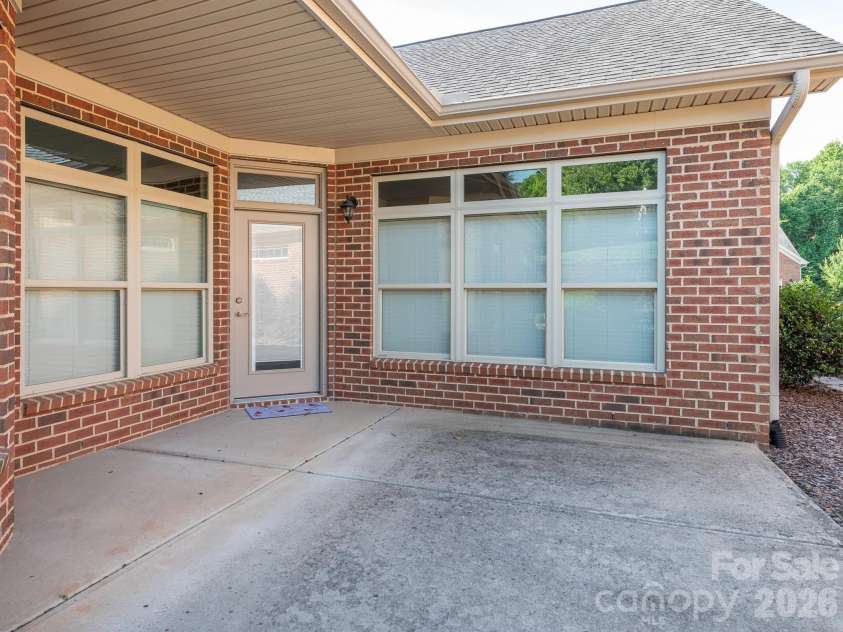 4534 Ideal Way, Harrisburg, NC 28075.  MLS# CAR4377645, YatesRealty ID 29209. Private back patio is partially covered