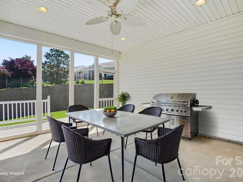 8036 Crater Lake Drive, Fort Mill, SC 29707.  MLS# CAR4390764, YatesRealty ID 29219. Virtual Staged Dining on Covered Porch