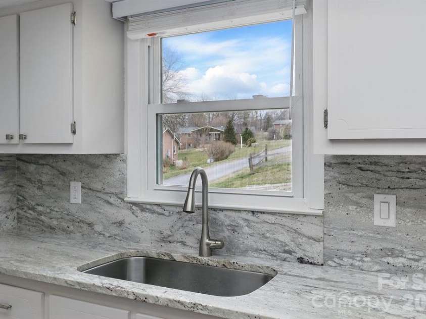 114 Falling Waters Road, Hendersonville, NC 28792.  MLS# CAR4390548, YatesRealty ID 29220. New windows throughout, gorgeous countertops and backsplash
