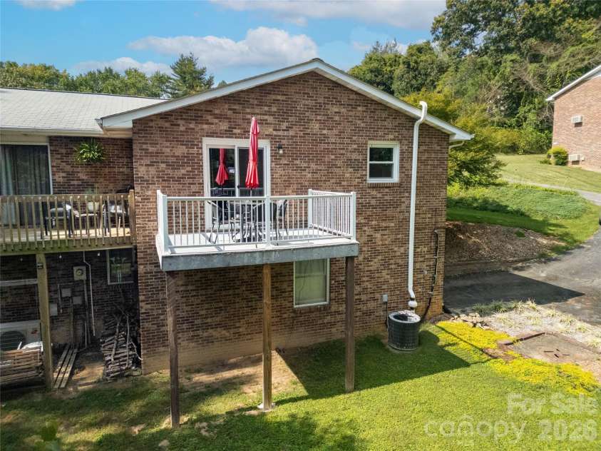 114 Falling Waters Road, Hendersonville, NC 28792.  MLS# CAR4426229, YatesRealty ID 29220. Back view of home
