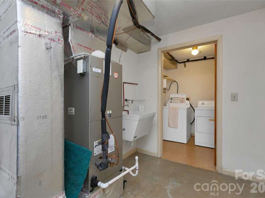 114 Falling Waters Road, Hendersonville, NC 28792.  MLS# CAR4426229, YatesRealty ID 29220. Mechanical room and laundry with utility sink