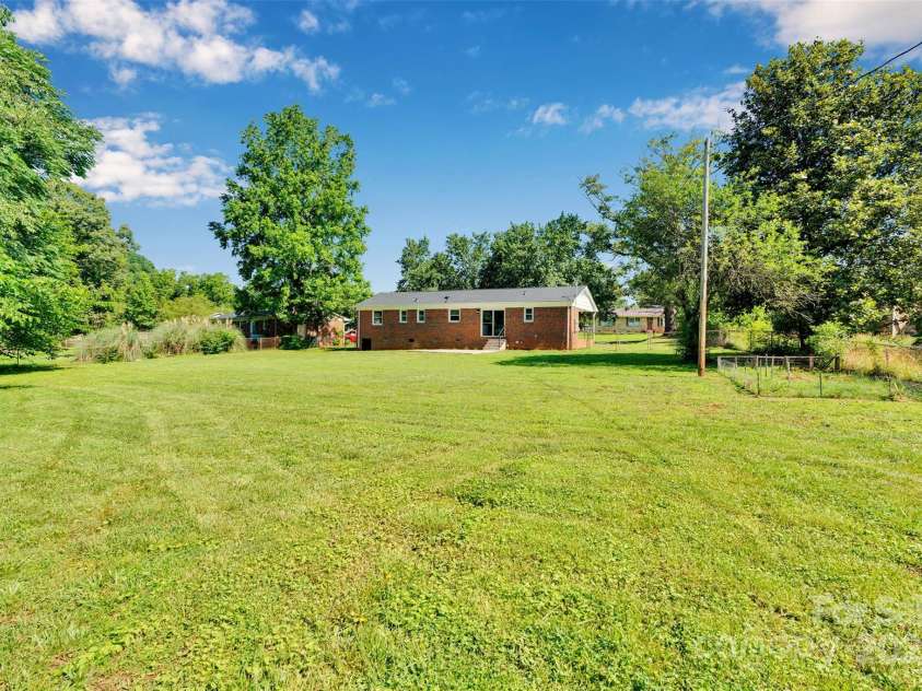 113 Lou Drive, Gastonia, NC 28052.  MLS# CAR4270786, YatesRealty ID 29229. Back of house