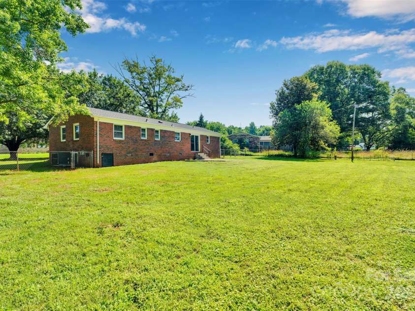 113 Lou Drive, Gastonia, NC 28052.  MLS# CAR4270786, YatesRealty ID 29229. Back of house