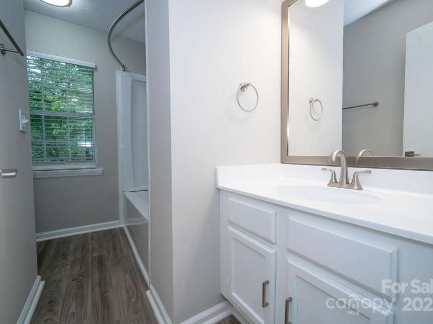 8125 Sheringham Way, Charlotte, NC 28227.  MLS# CAR4261059, YatesRealty ID 29230. Hallway Bathroom