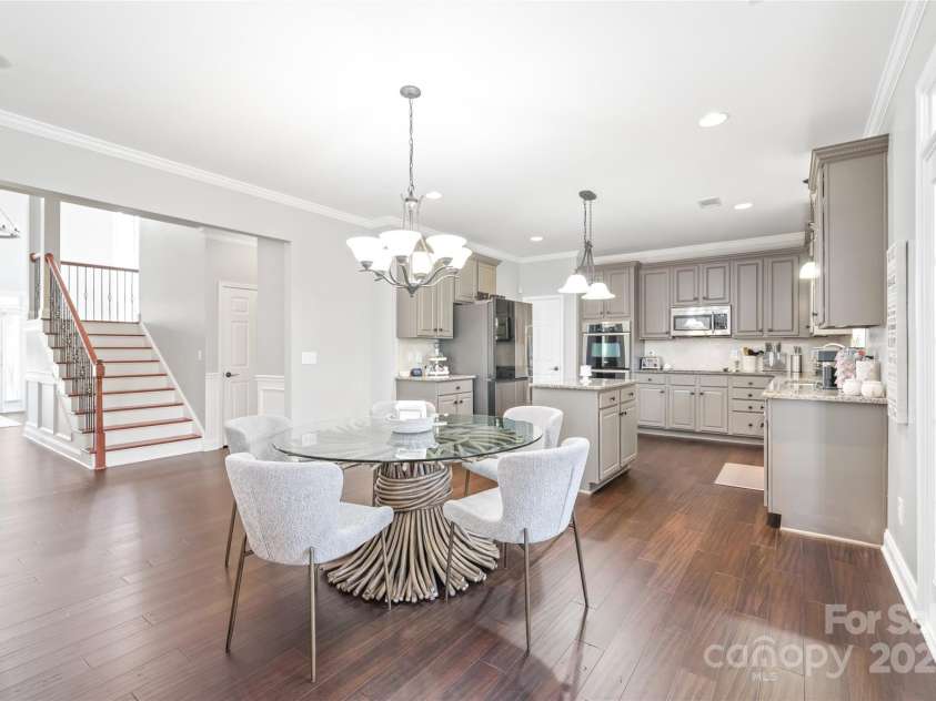 10951 Hat Creek Lane, Davidson, NC 28036.  MLS# CAR4284008, YatesRealty ID 29232. Entry to the screened in sun room is just off the breakfast area