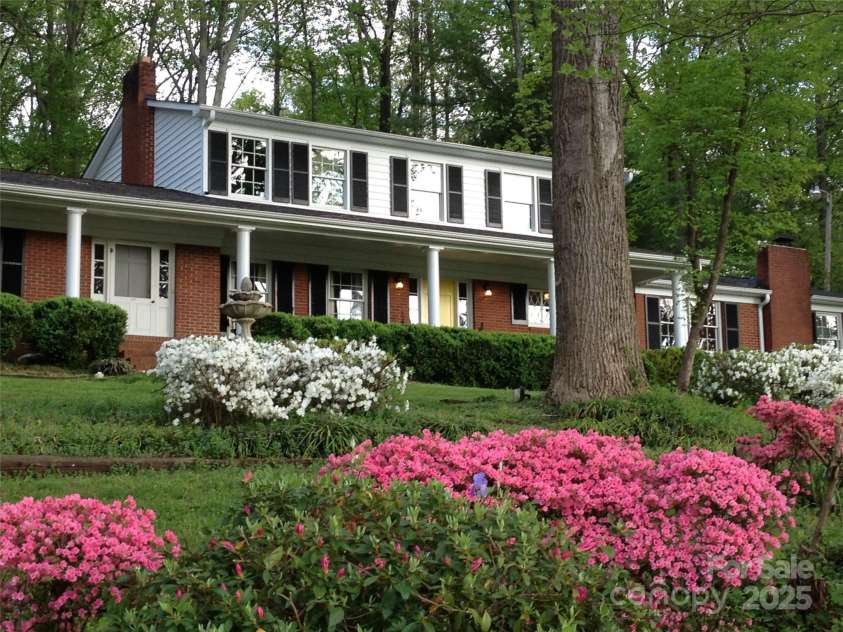 1055 Fairway Lane, Lincolnton, NC 28092.  MLS# CAR4284605, YatesRealty ID 29235. Yard blooming in the spring