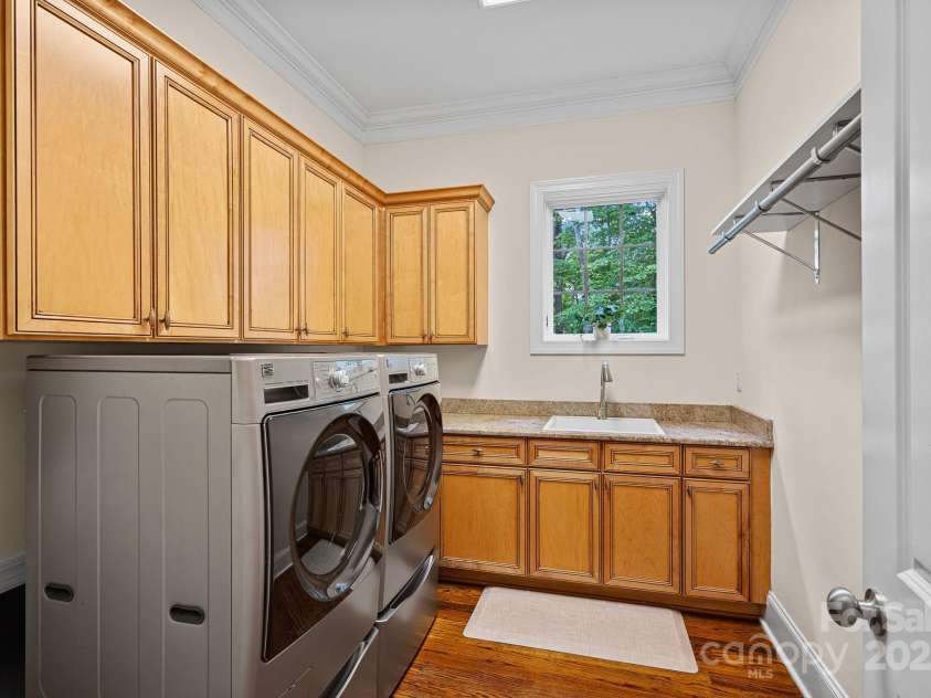 1305 Anniston Place, Wesley Chapel, NC 28079.  MLS# CAR4250299, YatesRealty ID 29238. Laundry room on main