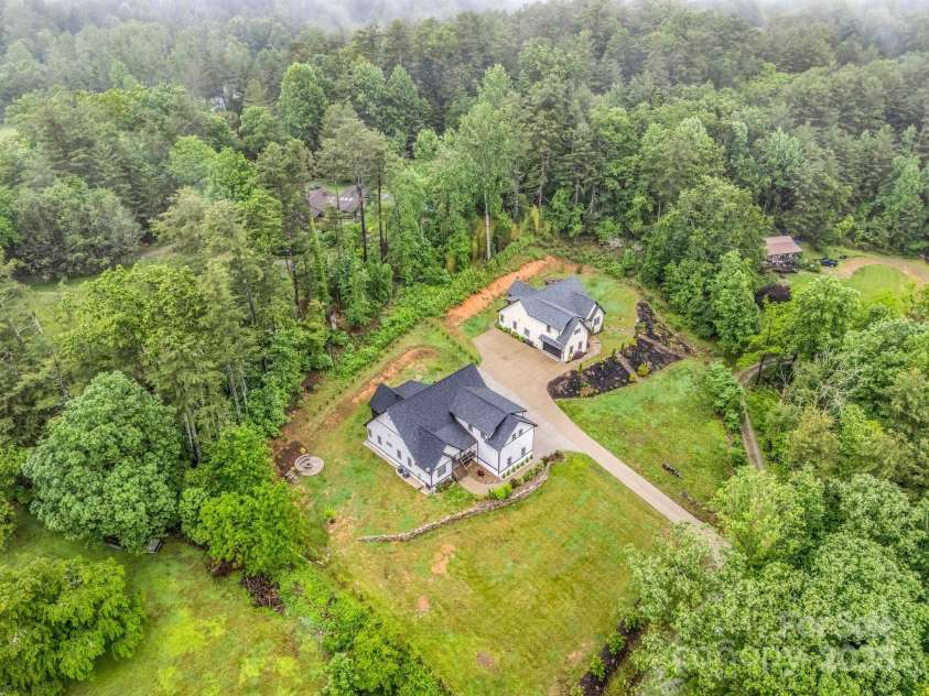 165 Kirkwood Hill Lane, Hendersonville, NC 28739.  MLS# CAR4264440, YatesRealty ID 29239. Aerial of home (165 is the left one)