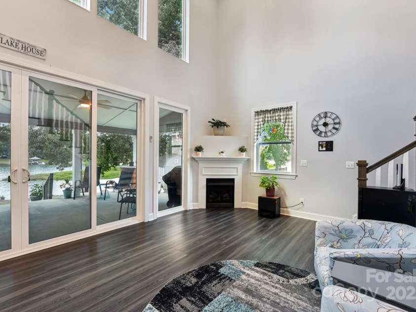 5141 Sapp Circle, Clover, SC 29710.  MLS# CAR4282509, YatesRealty ID 29244. Two-story great room—dual lighting/fans and a wall of glass to the water.