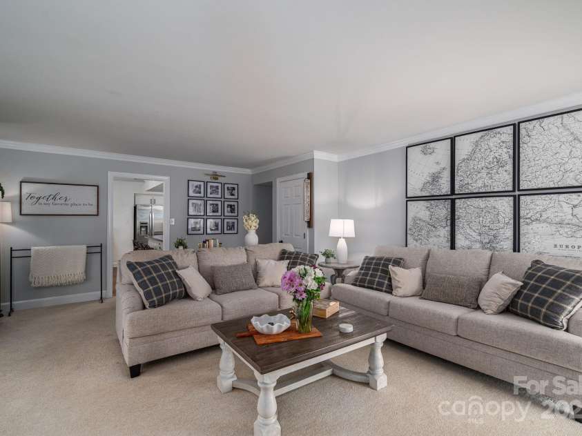 1705 Clubview Circle, Gastonia, NC 28056.  MLS# CAR4271543, YatesRealty ID 29247. Family room leading to kitchen and front hallway.