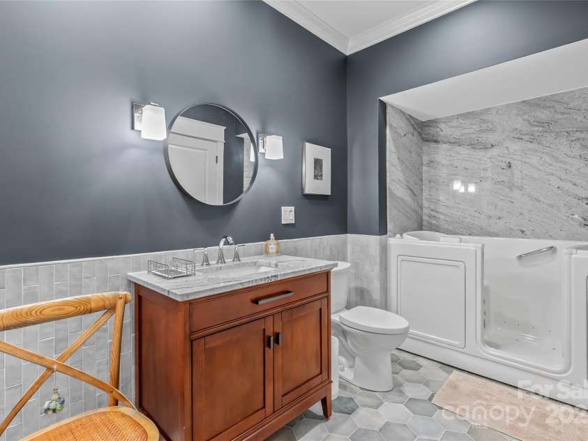 159 Alta Circle, Hendersonville, NC 28739.  MLS# CAR4300821, YatesRealty ID 2925. Guest bathroom downstairs, with American Standard walk-in tub with lifetime guarantee!