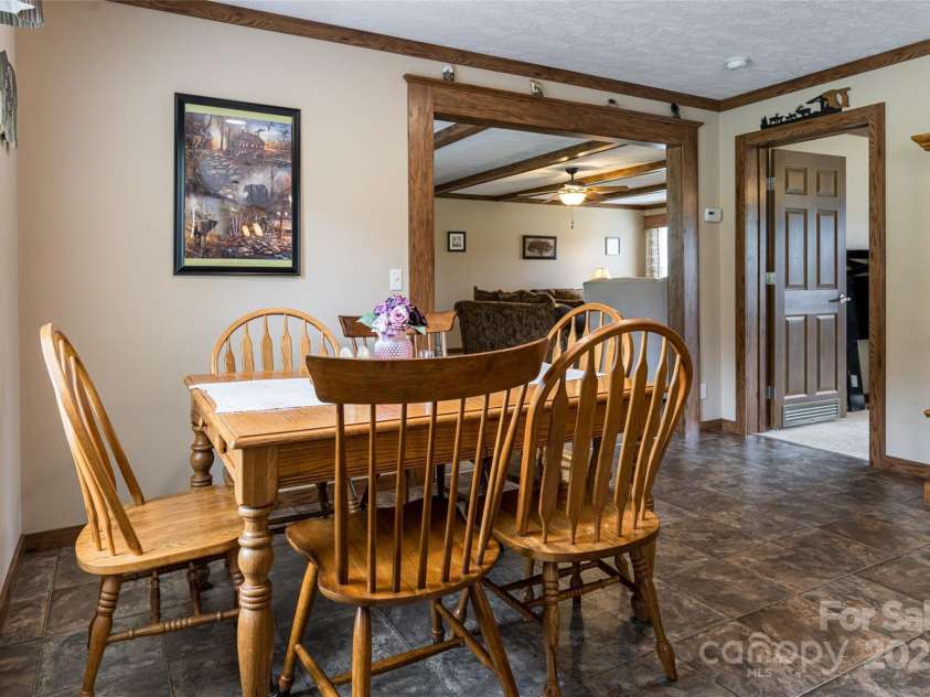 78 Hillcrest Drive, Candler, NC 28715.  MLS# CAR4286565, YatesRealty ID 29251. Dining area