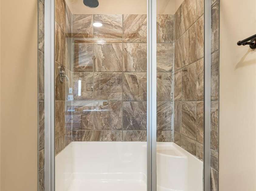 78 Hillcrest Drive, Candler, NC 28715.  MLS# CAR4286565, YatesRealty ID 29251. Large walk-in shower