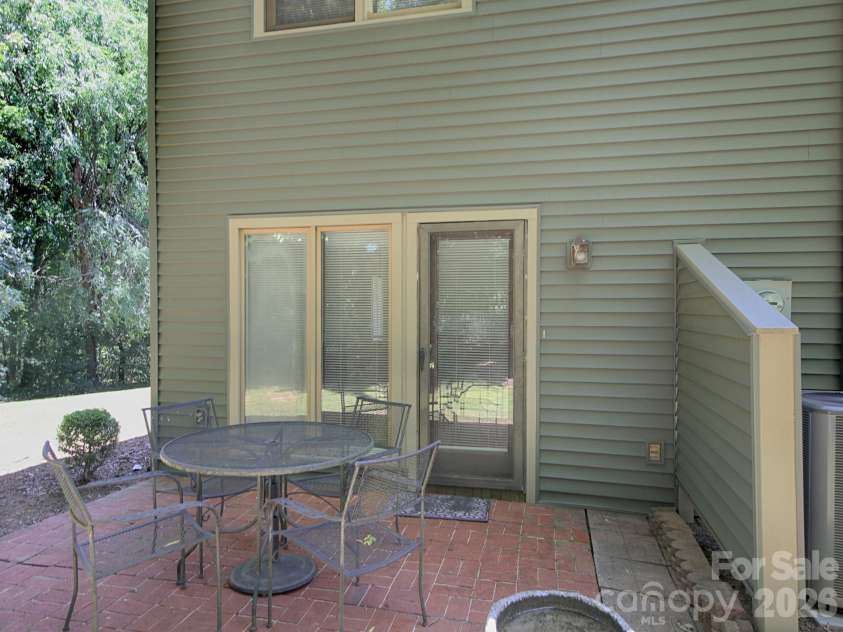 833 Coventry Lane, Statesville, NC 28677.  MLS# CAR4388371, YatesRealty ID 29251. Back patio has divider