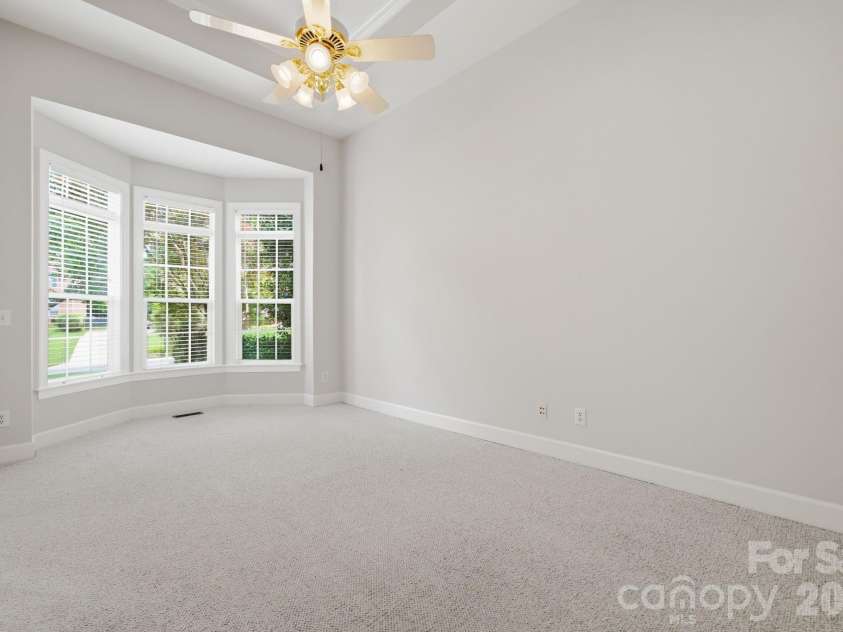 8719 Beaminster Place, Waxhaw, NC 28173.  MLS# CAR4390694, YatesRealty ID 29267. Office with bayed window, and 12' tray ceiling
