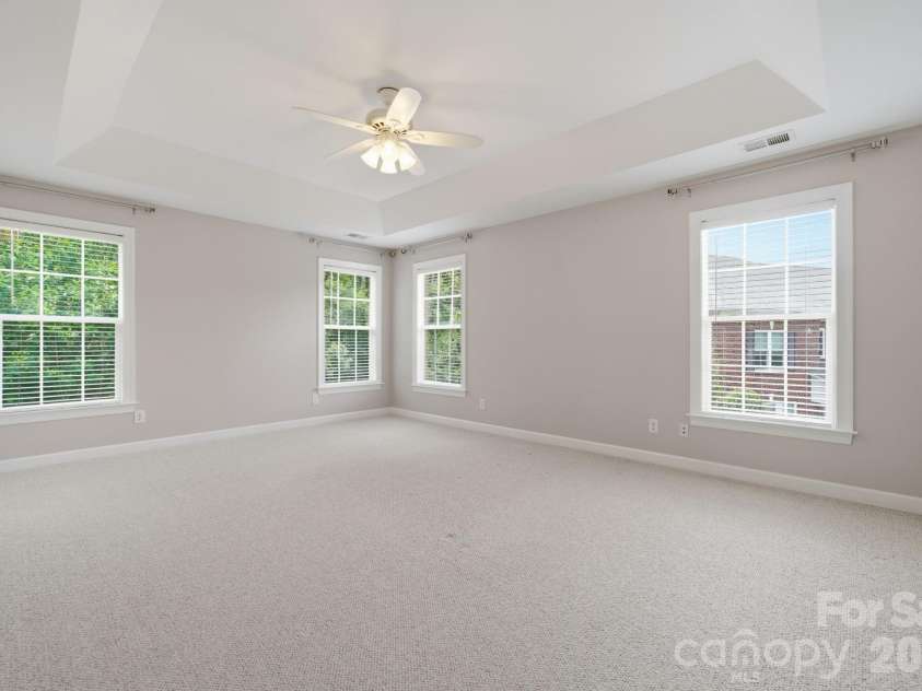 8719 Beaminster Place, Waxhaw, NC 28173.  MLS# CAR4390694, YatesRealty ID 29267. Owners Bedroom with Tray ceiling