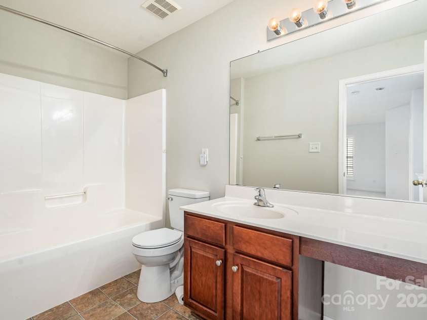 3822 Carl Parmer Drive, Harrisburg, NC 28075.  MLS# CAR4223446, YatesRealty ID 2927. Hall bathroom upstairs