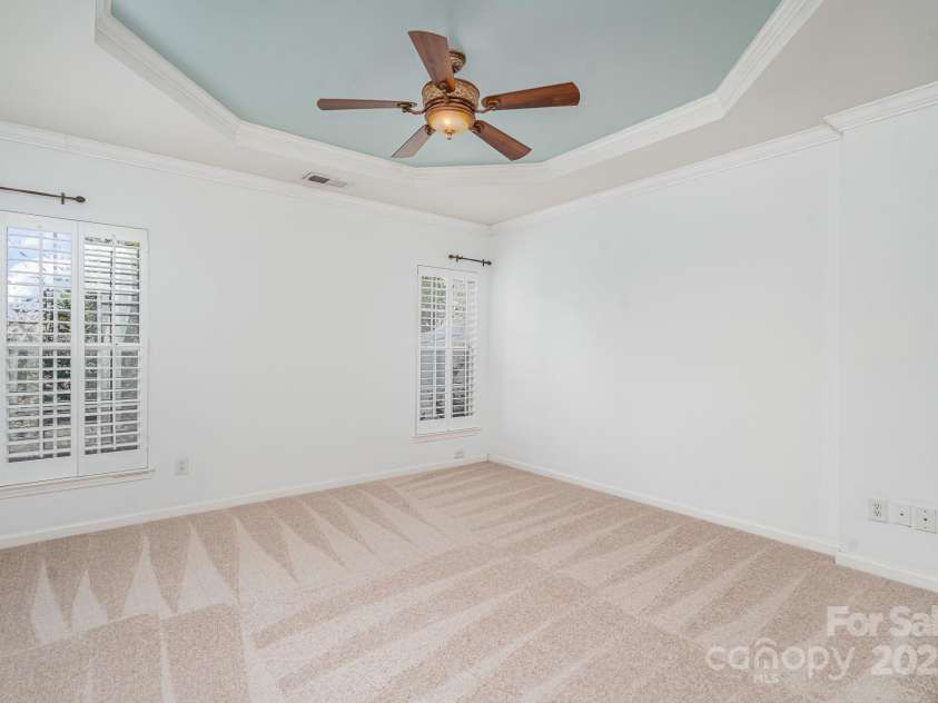 3822 Carl Parmer Drive, Harrisburg, NC 28075.  MLS# CAR4223446, YatesRealty ID 2927. Primary bedroom has elegant tray ceiling.  Brand new carpet