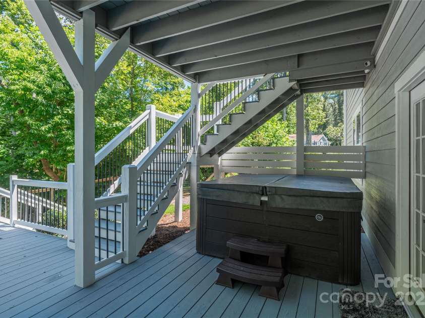 348 Olivet Lane, Fletcher, NC 28732.  MLS# CAR4287299, YatesRealty ID 29273. Enjoy a dip in the hot tub on the lower covered portion of the deck.  Relax and unwind in privacy.