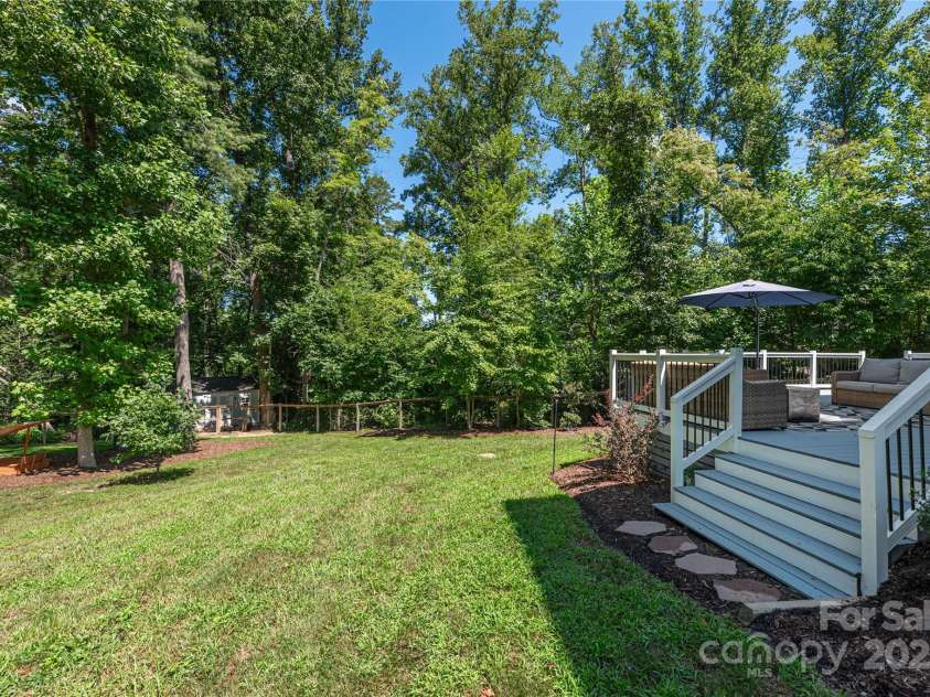 348 Olivet Lane, Fletcher, NC 28732.  MLS# CAR4287299, YatesRealty ID 29273. Large acre lot with fenced rear yard and tons of space to play.