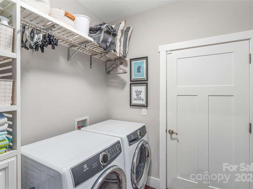 348 Olivet Lane, Fletcher, NC 28732.  MLS# CAR4287299, YatesRealty ID 29273. Laundry Room off Garage Entrance--Washer and Dryer Convey