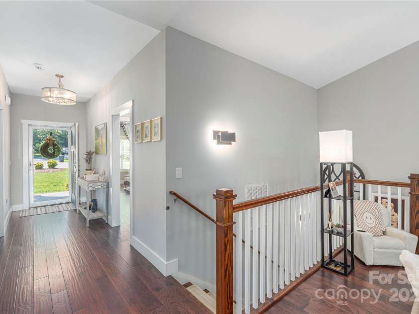 348 Olivet Lane, Fletcher, NC 28732.  MLS# CAR4287299, YatesRealty ID 29273. Stairs to lower level.  Look at those hardwoods!
