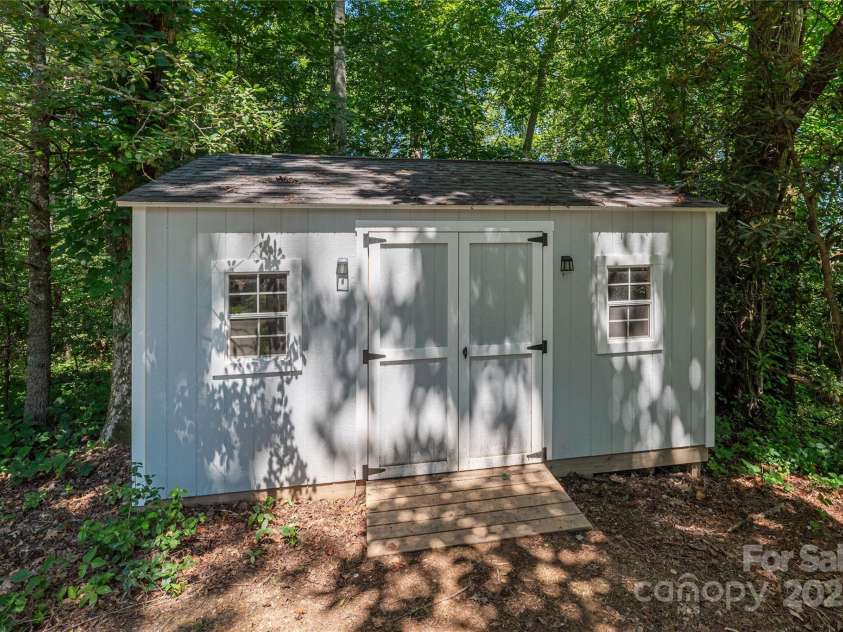348 Olivet Lane, Fletcher, NC 28732.  MLS# CAR4287299, YatesRealty ID 29273. Storage building in rear yard to keep your toys or tools!
