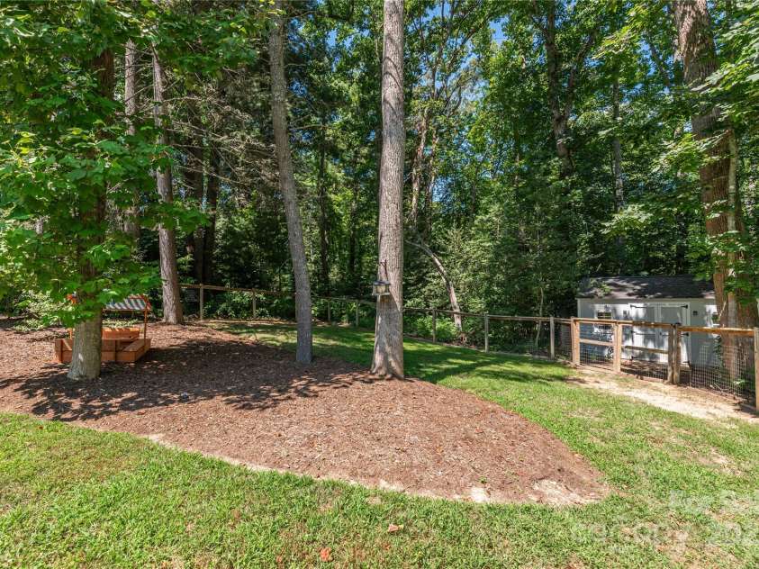 348 Olivet Lane, Fletcher, NC 28732.  MLS# CAR4287299, YatesRealty ID 29273. Trees provide a border of privacy and shade.