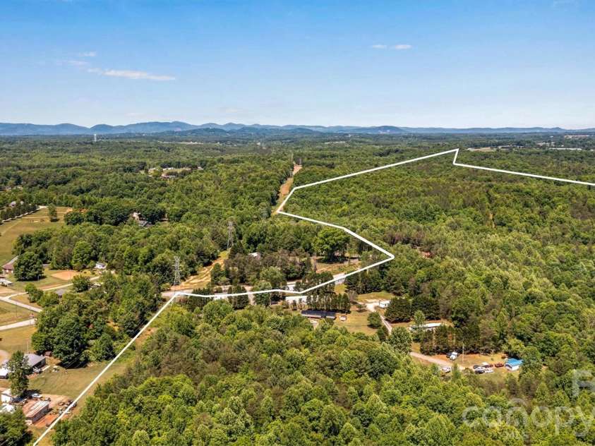 21 Little River Estates Drive, Taylorsville, NC 28681.  MLS# CAR4390374, YatesRealty ID 29275. Aerial View - Lot Lines are Approximate