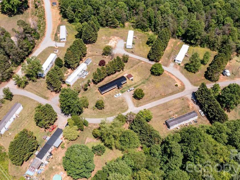 21 Little River Estates Drive, Taylorsville, NC 28681.  MLS# CAR4390374, YatesRealty ID 29275. Focused Aerial View (Front 11 Homes, 3 New Homes not pictured)