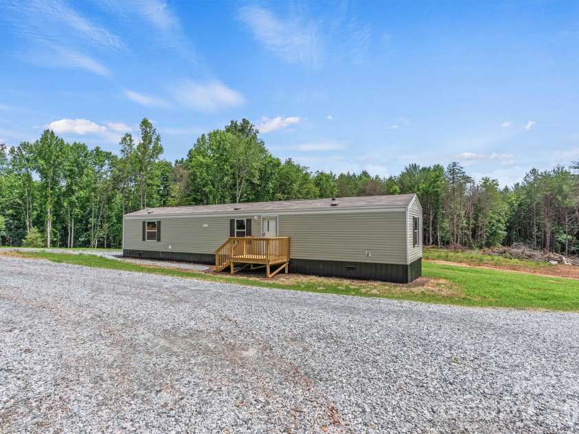 21 Little River Estates Drive, Taylorsville, NC 28681.  MLS# CAR4390374, YatesRealty ID 29275. New Home Focused Front View (Total of 3 New Homes) 