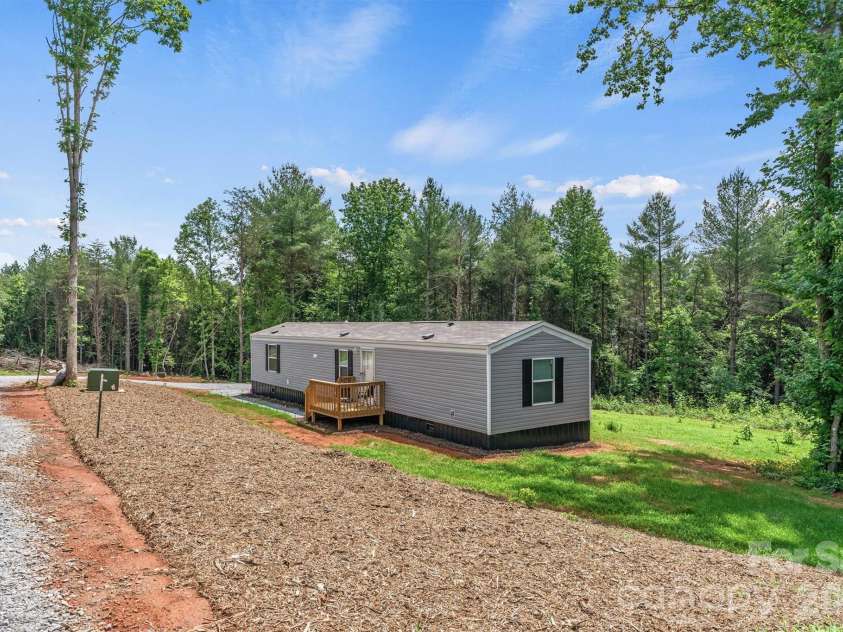 21 Little River Estates Drive, Taylorsville, NC 28681.  MLS# CAR4390374, YatesRealty ID 29275. New Home/Focused Drive View (Total of 3 New Homes) 