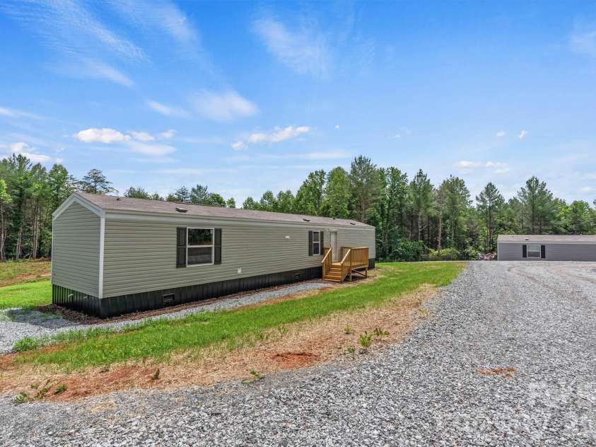 21 Little River Estates Drive, Taylorsville, NC 28681.  MLS# CAR4390374, YatesRealty ID 29275. New Home/Focused Drive View (Total of 3 New Homes)