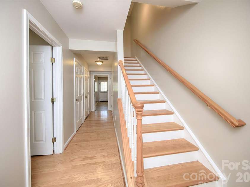 14556 Reese Boulevard, Huntersville, NC 28078.  MLS# CAR4380745, YatesRealty ID 29278. 1st Floor Main Hallway with hardwood flooring leada to large Laundry/Mud Room with lots of Storage
