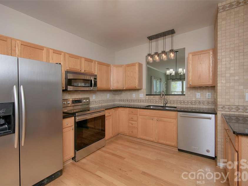 14556 Reese Boulevard, Huntersville, NC 28078.  MLS# CAR4380745, YatesRealty ID 29278. Beautiful pass-through area connecting Dining Area with Kitchen. All new lighting