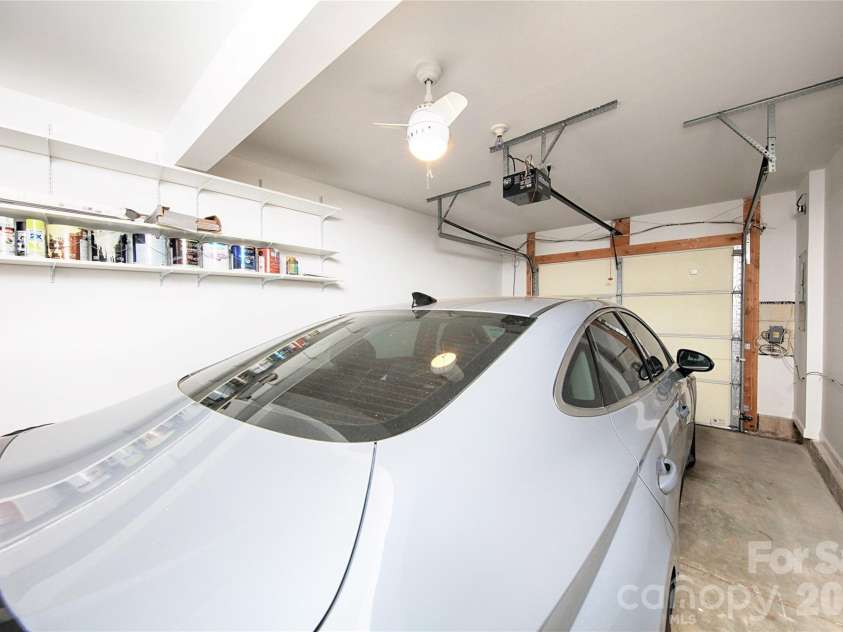 14556 Reese Boulevard, Huntersville, NC 28078.  MLS# CAR4380745, YatesRealty ID 29278. Extra deep garage can accommodate a car and a motorcycle.  walls have been recently finished and painted