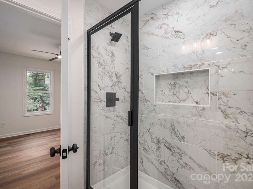 1964 Noles Circle, Lincolnton, NC 28092.  MLS# CAR4285826, YatesRealty ID 29281. Tiled shower in primary bath