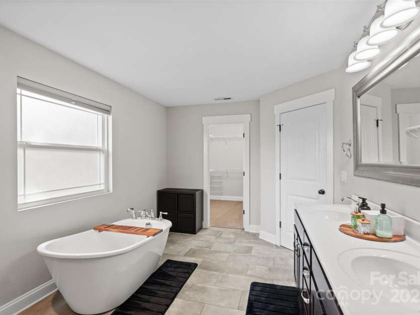 1774 Timmons Marie Lane, Lincolnton, NC 28092.  MLS# CAR4276228, YatesRealty ID 29284. Your primary bath oasis. Beautiful garden soaking tub, double vanities, and large shower.