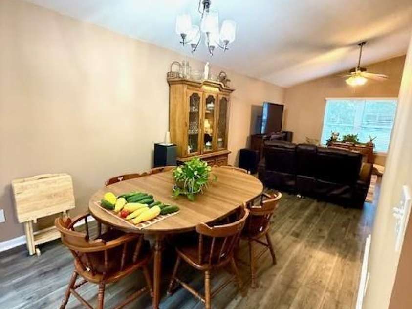 6340 Ellesmere Court, Mint Hill, NC 28227.  MLS# CAR4276855, YatesRealty ID 29296. Dining Room and Den with Open Concept