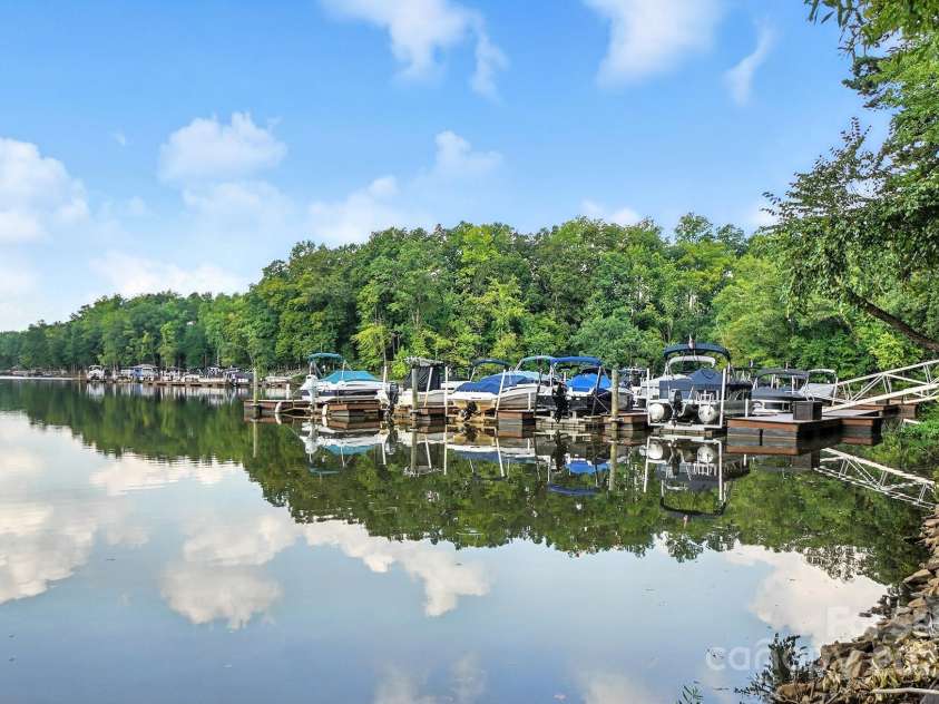 4128 La Crema Drive, Charlotte, NC 28214.  MLS# CAR4284944, YatesRealty ID 29298. For boating enthusiasts, boat slips are available for purchase just steps away, providing effortless access to Lake Wylie's adventures