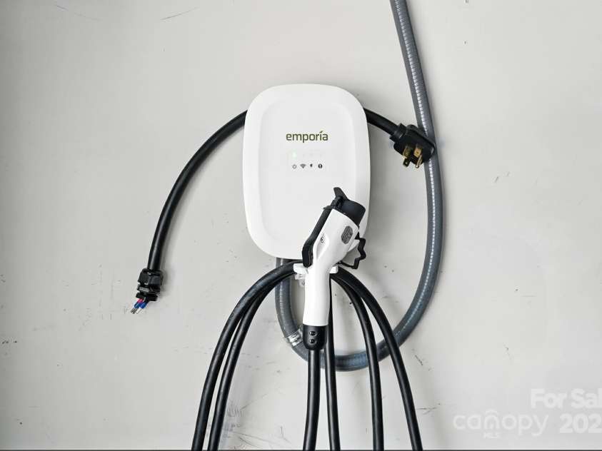 4128 La Crema Drive, Charlotte, NC 28214.  MLS# CAR4284944, YatesRealty ID 29298. Practicality meets modern convenience with a two-car garage featuring an electric port for a generator and a charger for your electric vehicle