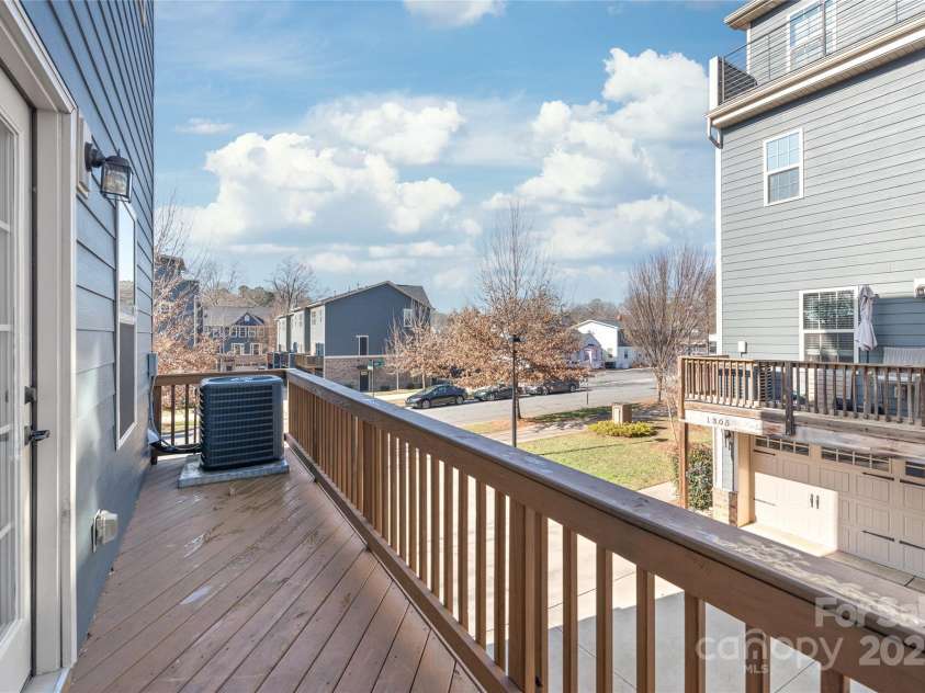 1304 Queen Lyon Court, Charlotte, NC 28205.  MLS# CAR4213262, YatesRealty ID 2930. Cozy outdoor terrace off of kitchen/dining - great for entertaining!