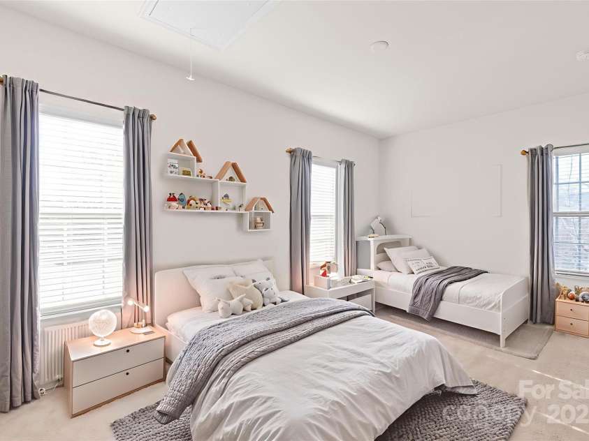 1304 Queen Lyon Court, Charlotte, NC 28205.  MLS# CAR4213262, YatesRealty ID 2930. Large secondary bedroom staged