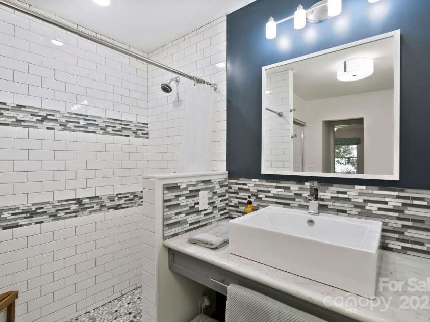 5914 Mt Holly Huntersville Road, Charlotte, NC 28216.  MLS# CAR4273144, YatesRealty ID 29300. Large walk-in tile shower